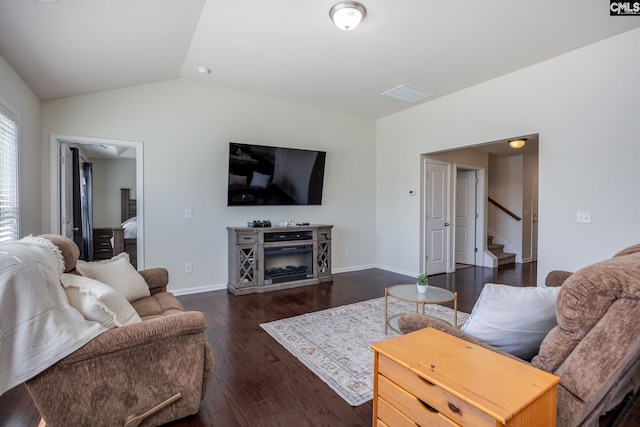 living area featuring a fireplace, lofted ceiling, dark wood-style floors, and baseboards