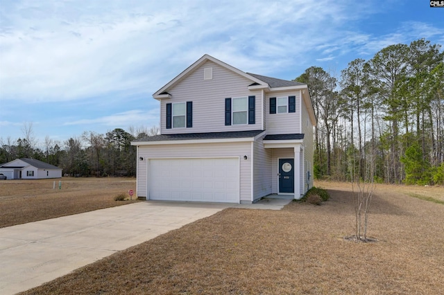 traditional home featuring an attached garage, driveway, and a shingled roof