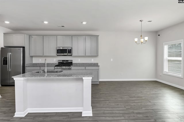 kitchen with recessed lighting, gray cabinets, appliances with stainless steel finishes, and a sink