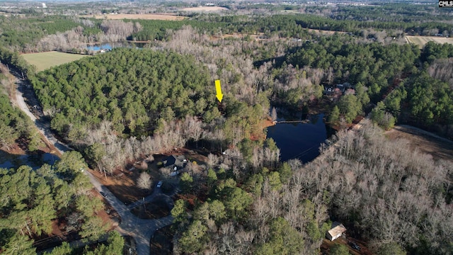 aerial view with a water view and a view of trees