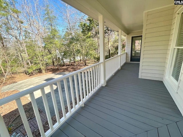 wooden terrace featuring a porch