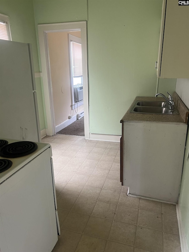 kitchen featuring a sink, cooling unit, and white appliances