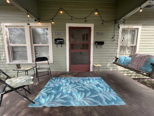 property entrance with covered porch