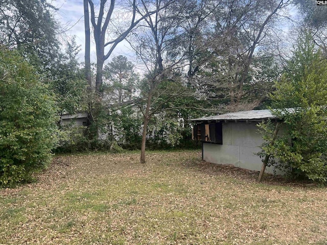 view of yard with an outbuilding and a storage shed