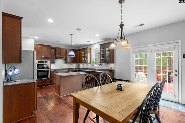 dining room featuring recessed lighting, visible vents, and dark wood finished floors