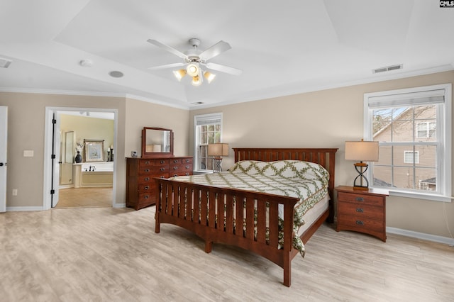 bedroom featuring visible vents, multiple windows, light wood-style flooring, and ornamental molding