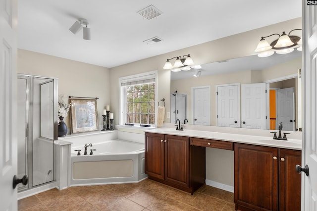 bathroom with visible vents, a garden tub, a stall shower, a sink, and double vanity