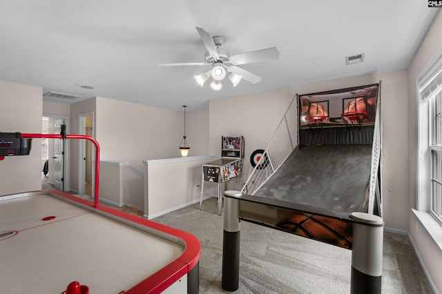 recreation room with visible vents and baseboards