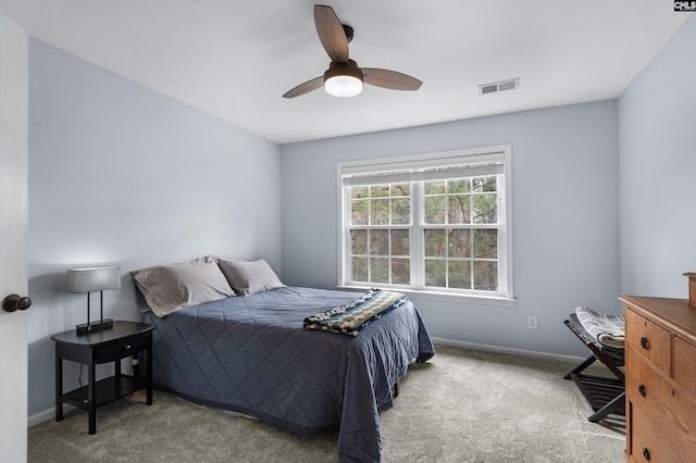 bedroom featuring baseboards, visible vents, carpet floors, and ceiling fan