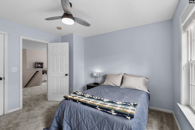 bedroom with baseboards, carpet floors, and ceiling fan