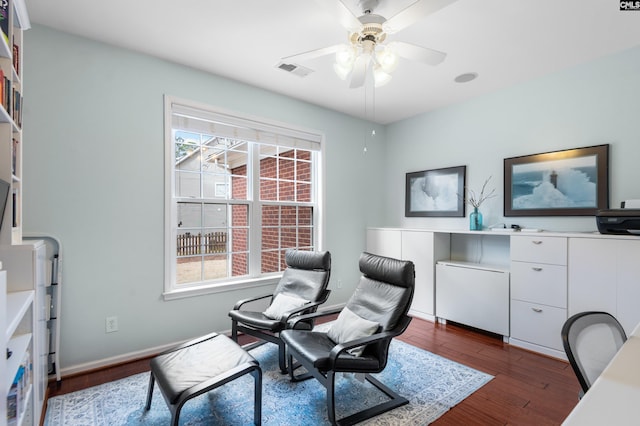 office featuring visible vents, baseboards, dark wood-type flooring, and a ceiling fan