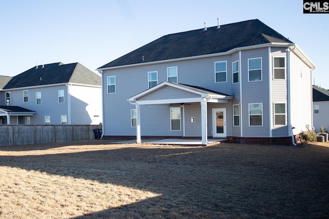 rear view of property with a patio area, a ceiling fan, and fence