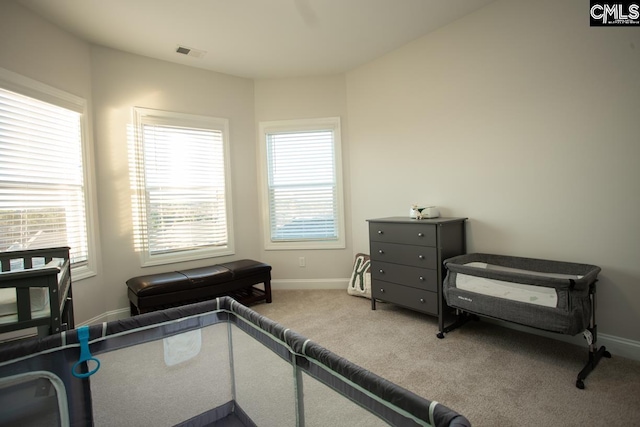 bedroom featuring visible vents, baseboards, and carpet floors