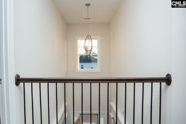 room details featuring a notable chandelier and visible vents