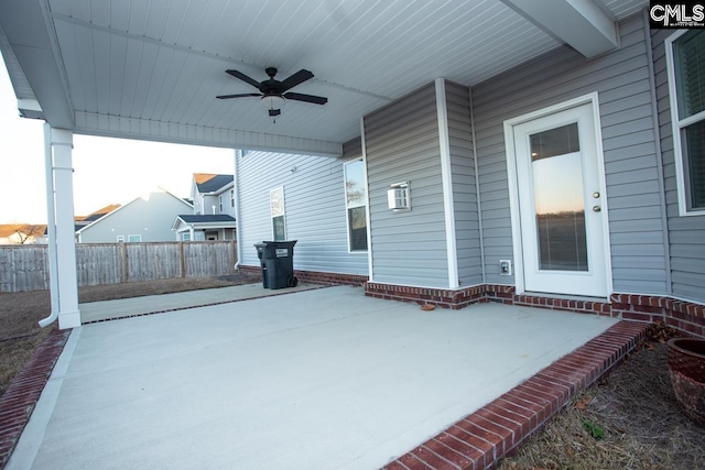 view of patio / terrace featuring a ceiling fan and fence