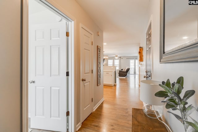 corridor featuring light wood-style flooring