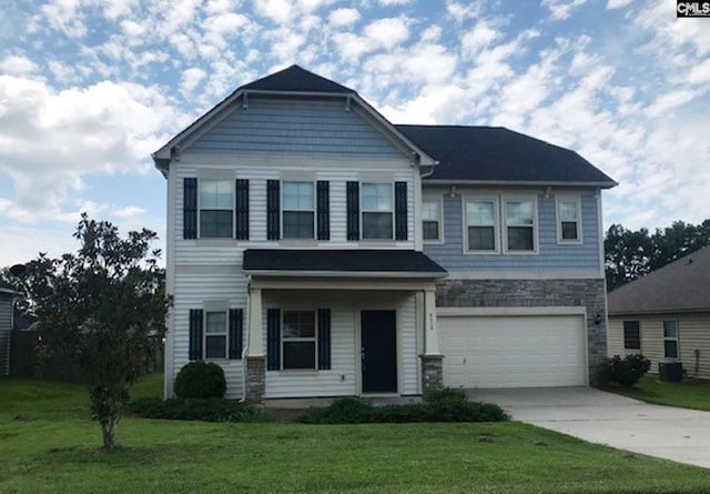 craftsman-style house with a front lawn, an attached garage, stone siding, and driveway