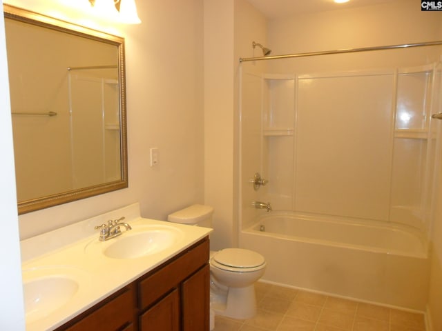 bathroom with double vanity, shower / bath combination, toilet, and a sink