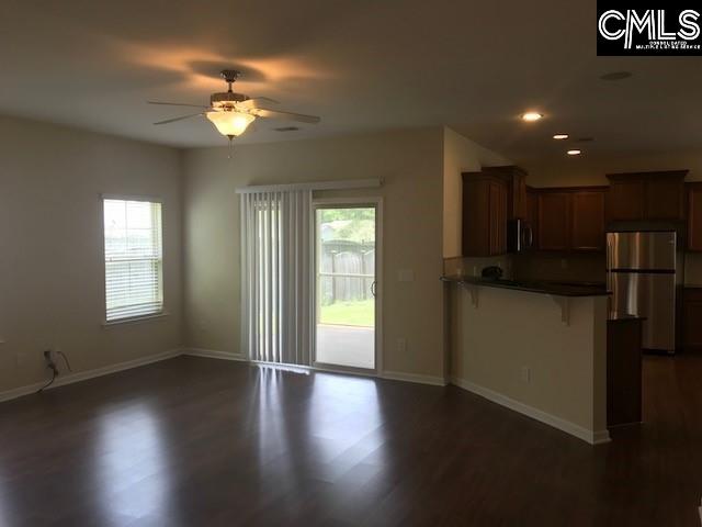 kitchen featuring open floor plan, plenty of natural light, appliances with stainless steel finishes, and a peninsula