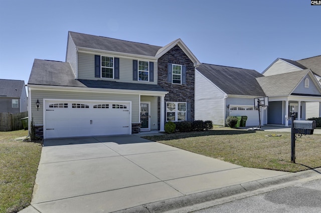 view of front facade featuring a garage, stone siding, a front yard, and driveway