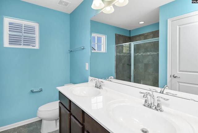 full bath with visible vents, a stall shower, baseboards, and a sink