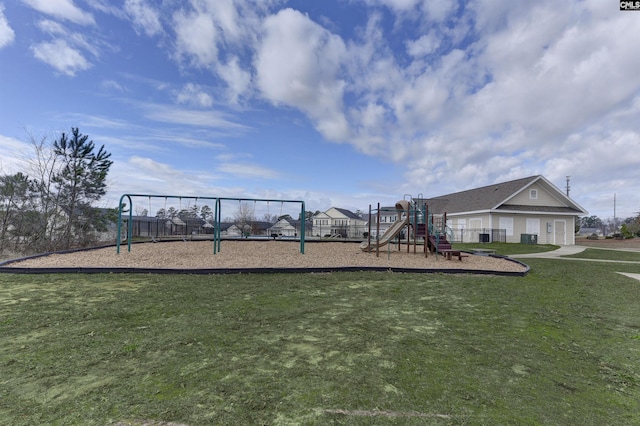 communal playground featuring a lawn