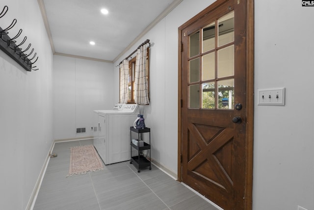 washroom with visible vents, independent washer and dryer, ornamental molding, baseboards, and laundry area