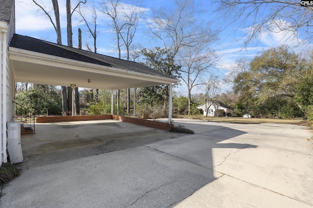 exterior space with a carport and driveway