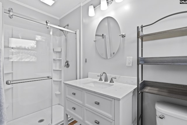 full bath with vanity, toilet, a stall shower, and crown molding