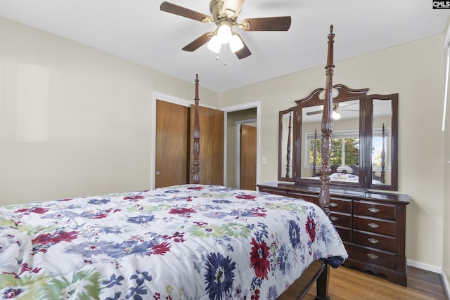 bedroom with a ceiling fan and wood finished floors