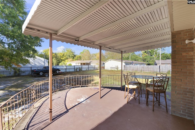 view of patio / terrace featuring outdoor dining space and fence