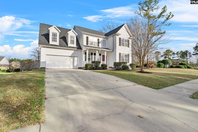 view of front facade featuring a garage, covered porch, driveway, and a front lawn