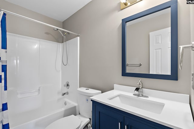 bathroom featuring shower / washtub combination, toilet, and vanity