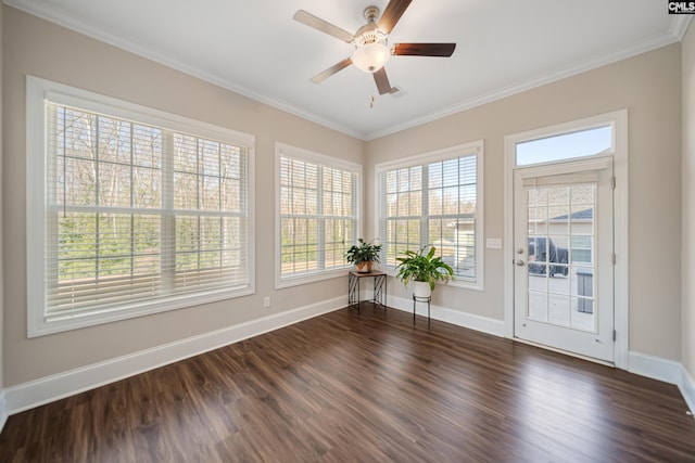 unfurnished sunroom featuring ceiling fan