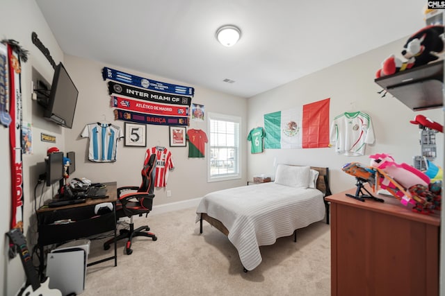 bedroom featuring light carpet, visible vents, and baseboards