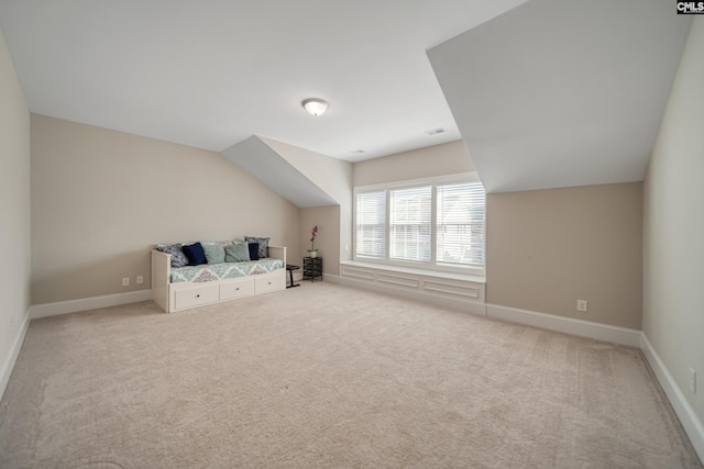 bonus room with baseboards, carpet floors, and lofted ceiling