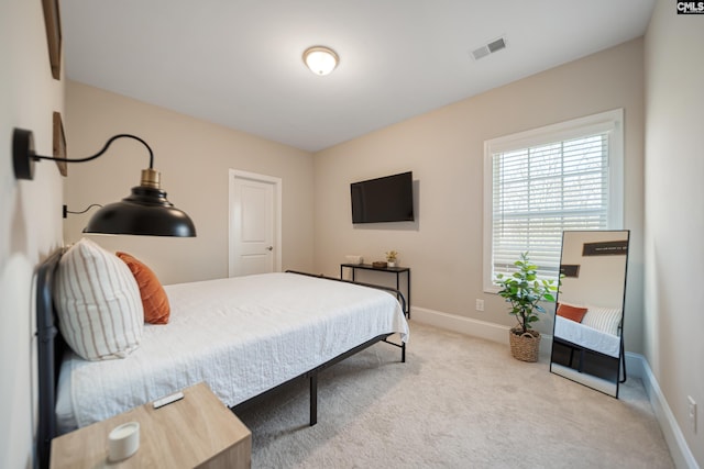 bedroom with visible vents, baseboards, and carpet flooring