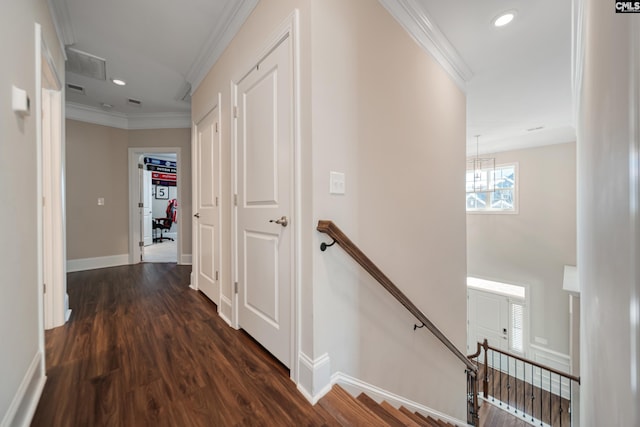 hall featuring baseboards, an upstairs landing, dark wood-style flooring, and ornamental molding