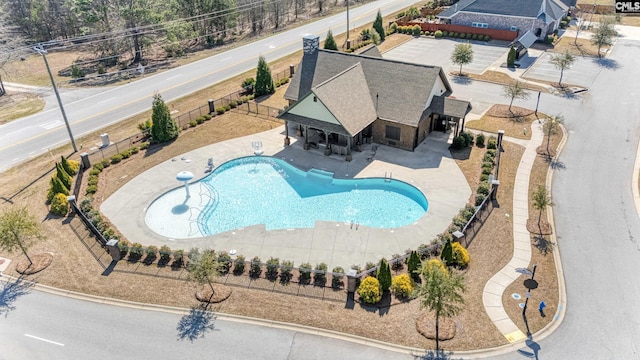 pool featuring a fenced backyard and a patio area