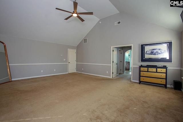 unfurnished living room with visible vents, ceiling fan, high vaulted ceiling, and carpet