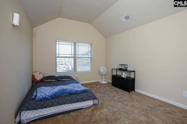 bedroom with visible vents, baseboards, lofted ceiling, and carpet floors