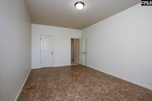 unfurnished bedroom with baseboards