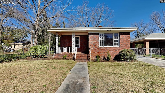 bungalow featuring brick siding, a porch, a front yard, and fence