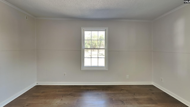 unfurnished room with baseboards, a textured ceiling, ornamental molding, and dark wood-style flooring