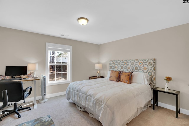 carpeted bedroom featuring visible vents and baseboards