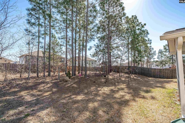 view of yard with a fenced backyard