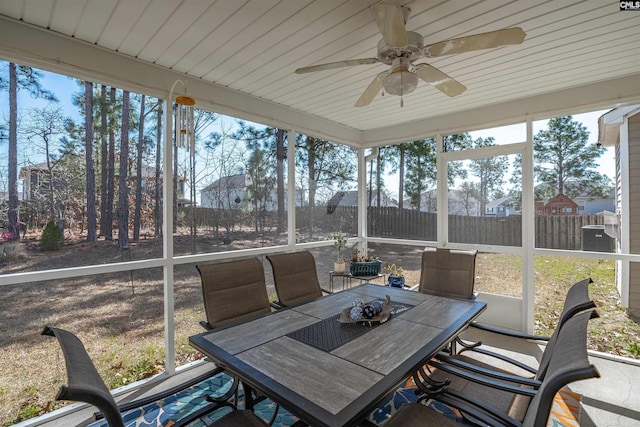 sunroom featuring ceiling fan