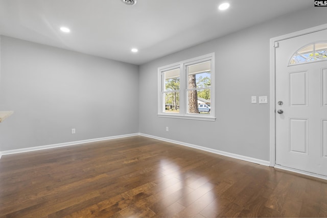 entrance foyer featuring dark wood finished floors, recessed lighting, and baseboards