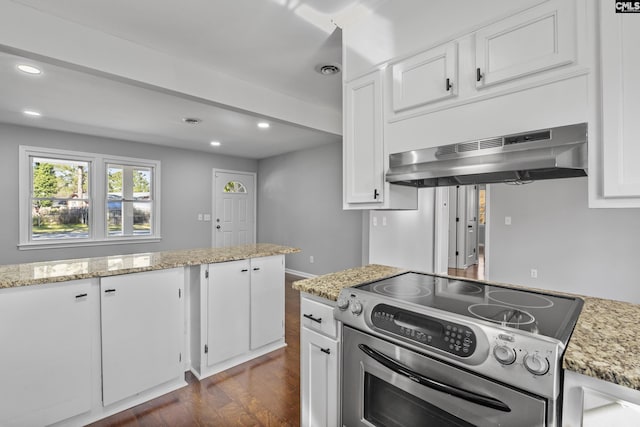 kitchen featuring stainless steel range with electric stovetop, under cabinet range hood, recessed lighting, white cabinets, and dark wood-style flooring