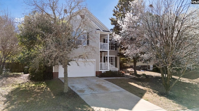 view of front of home with concrete driveway, a balcony, an attached garage, and brick siding